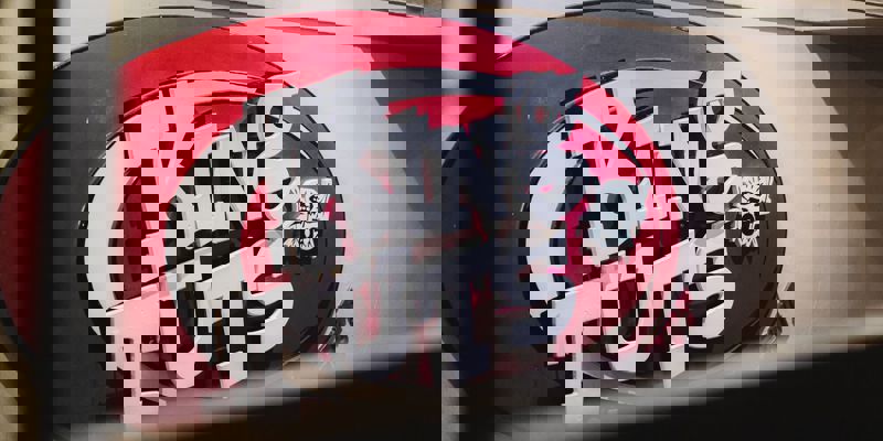 A close-up shot of the King Tut's Wah Wah Hut logo, a vibrant red and white sign for the famous Glasgow live music venue.